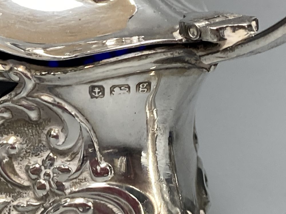 An Edwardian pierced silver three piece quatrefoil condiment set by William Oliver, Birmingham, 1906,